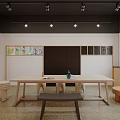 Kindergarten Learning Space With Large Wooden Table Small Stools And Children's Paintings On Wall