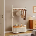 Standing Clothes Rack with Hanging Coats and Woven Storage Shelf in Cozy Home Bedroom