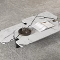 Sleek White Marble Coffee Table With Cracked Pattern Holding Open Book Wine Glasses On Tray