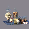 Assorted Cookies Candies and Cake in Glass Jars on a Serving Tray