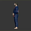Martial Artist In Blue Judo Uniform With Black Belt And Red Dragon Creature Posing