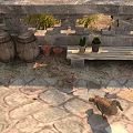 Reptile Lizard Crawling On Patterned Stone Pavement By Wooden Barrels And Potted Plants
