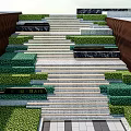 Outdoor Staircase With Gray Steps Brown Side Walls And Lush Green Landscaping
