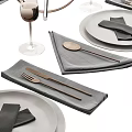 Elegant Modern Tableware Set Featuring Gray Plates Black Napkins Wine Glasses Cutlery And Candle Holders