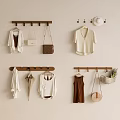 White Cardigan Top Brown Dress With Bags Hat Umbrella Hanging On Wall Mounted Wooden Racks