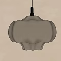 Elegant Petal Shaped Beige Fabric Pendant Light with Warm Lighting Against Textured Wall