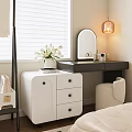 Elegant White Dressing Vanity With Drawers Round Mirror Pendant Lamp And White Flowers Near Stool In Bedroom