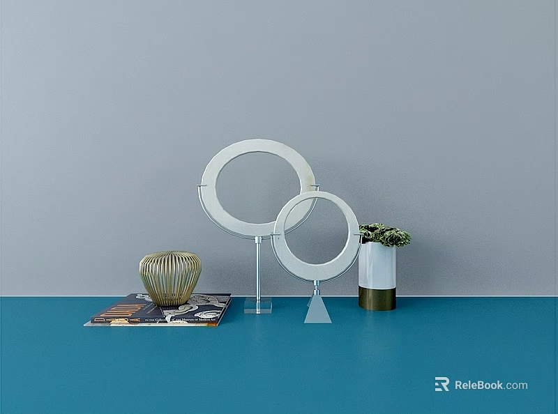 Stylish Tabletop Ornament Decor Set With Circular Rings Golden Vase And Green Plant 3d model 