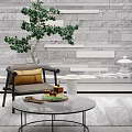 Stylish Leisure Chair With Yellow Cushion Green Plant And White Table Against Gray Stone Wall