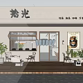 Milk Tea Shop With White Building Wooden Deck Outdoor Tables Chairs Plants And Poster