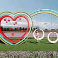 Colorful Heart Shaped Garden Ornament With Swing In Purple Flower Field Under Blue Sky