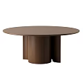 Modern Decorative Ornament Set Arranged On Brown Round Wooden Table For Home Decor