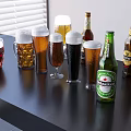 Different Beer Bottles And Glasses With Frothy Tops And Assorted Beer Colors On Black Table