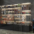 Glass Display Cabinet Showcasing Action Figures Collectibles And Models With Illuminated Shelves