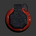 Red Spherical Weapon With Black Hexagonal Top And Textured Surface