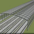 Long Covered Road Infrastructure With Transparent Roof Over Railway Tracks Surrounded By Green Grass