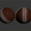 Three Red Cricket Balls With White Stitching On Dark Background