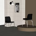Sleek Black Leather Dining Chairs With Metal Legs By White Tiled Wall And Painting