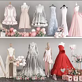 Elegant Formal Dresses In Various Styles With Balloons And Flower Bouquets On Mannequins