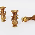 Decorative Ornament Set Featuring Three Golden Carved Vases with Intricate Designs