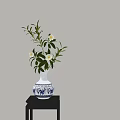 Blue and White Vase with White Flowers and Green Leaves on Dark Table Light Wall