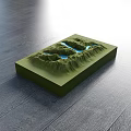 3D Terrain Model Business Equipment Featuring Green Mountains And Blue Water On Wooden Floor