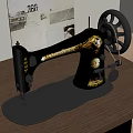 Vintage Black Gold Sewing Machine With Decorative Design And Metal Wheel On Wooden Table