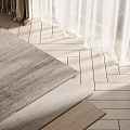 Square Rugs Stacked in Gray and Beige on Light Wood Floor with Curtains