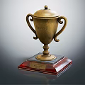 Golden Trophy With Curved Handles Lid And Red Transparent Base For Champion First Place