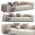 Modern Beige Fabric Three Seater Sofa With Cozy Pillows And Soft Knit Blanket