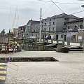 Modern Water Fountain Decorative Design With Stone Pavement And Yellow Railings In Outdoor Plaza