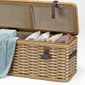 Wicker Storage Chests Open with Folded Colorful Fabrics and Woven Cushion Stool