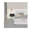 Cozy Bedroom Bedside Table With Table Lamp Clock And Flowers Next To Bed With Pillows