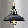 Black Metal Pendant Light With Wooden Top And Cage Design Glowing Bulb Against Gray Wall