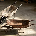 Vintage Metal Wheelbarrows As Essential Hardware Tools In Industrial Workshop