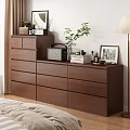 Brown Wooden Dresser With Drawers Potted Plant Photo Frame And Decor Items