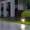 Outdoor Lights Illuminating Modern Building Lawn With Green Purple Shrubs And Paved Ground Reflections