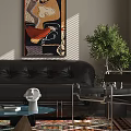 Black Leather Sofa and Glass Coffee Table Set With Green Plant and Wall Painting