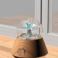 Modern Decorative Lamp With Transparent Glass Dome Blue Lighting And Wooden Base On Window Sill