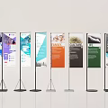 Multiple Banner Stands Displaying Various Content With Different Colors And Black Stands