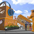 Bright Yellow Container Building With Cat Face Headphones Bear Sculpture And People Under Blue Sky