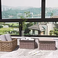 Three Wicker And Brown Woven Storage Baskets Indoor With Magazine Plant And Lake View Buildings