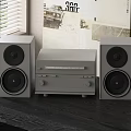 Modern Grey Home Stereo System With Speakers And Amplifier On Black Table