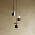 Minimalist Three Hanging Pendant Lights With Black Metal Shades Against Beige Wall Background