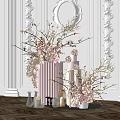 Elegant Floral Arrangement With Branches Cylinder Vase And Small Cake On White Sculpted Wall Background
