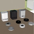 Various Robotic Vacuums With Different Colored Charging Stations On Wooden Floor
