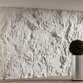 White Textured Background Wall with 3D Relief Design Illuminated by Side Lighting and Silver Planter 3d model