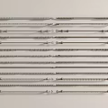 Different Types of Stainless Steel Medical Tools Arranged on White Surface