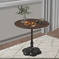 Round Wooden Side Table with Black Base Vase Green Plants Bowl Oranges and Tray
