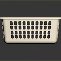 Beige Plastic Square Laundry Basket With Perforated Holes And Reflective Surface On Gray Background